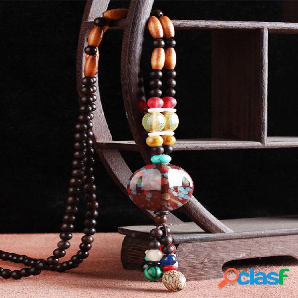 Collane con perline in legno di Bodhi con ciondolo in nappa
