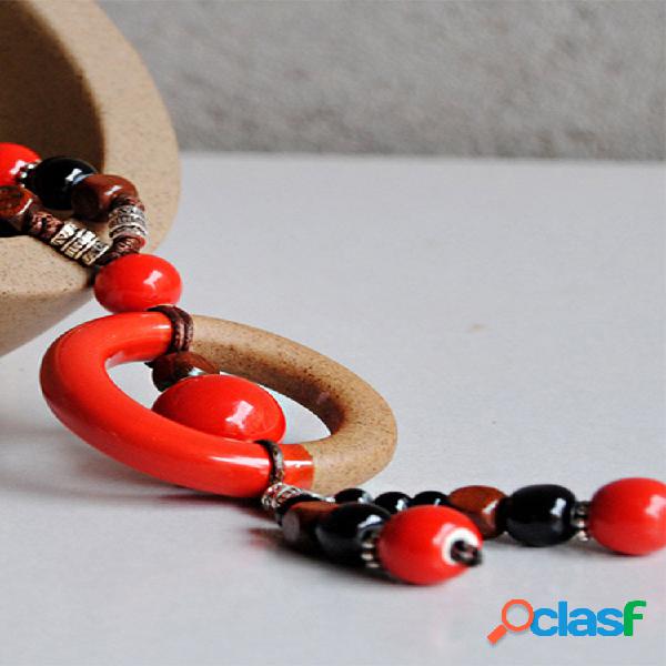 Collana lunga con perline in ceramica intrecciata a mano con