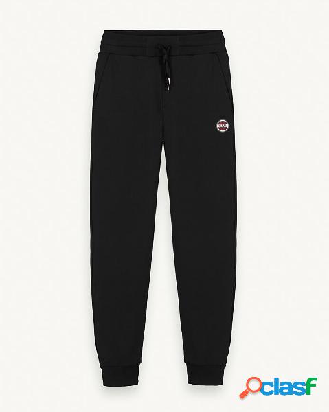 Pantalone nero in felpa di cotone con logo bollo applicato