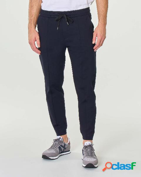 Pantalone blu in jersey stretch con taschine a filo con zip