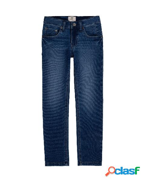 Jeans lavaggio medio stone washed con patch stivale iconico