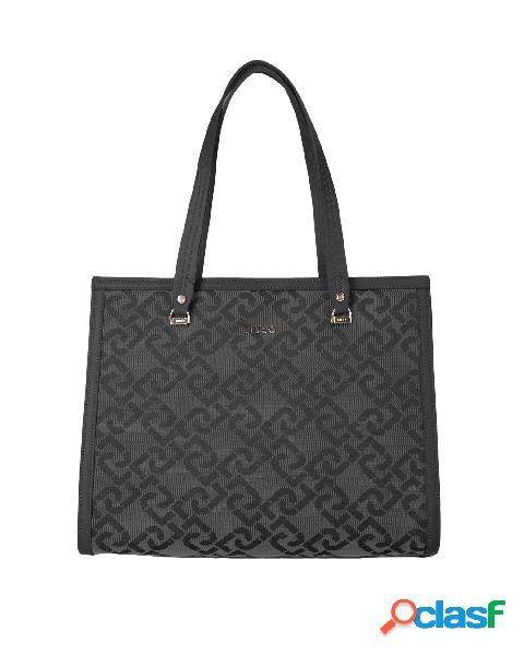 Shopping bag in tela nera monogrammata con profili e manici