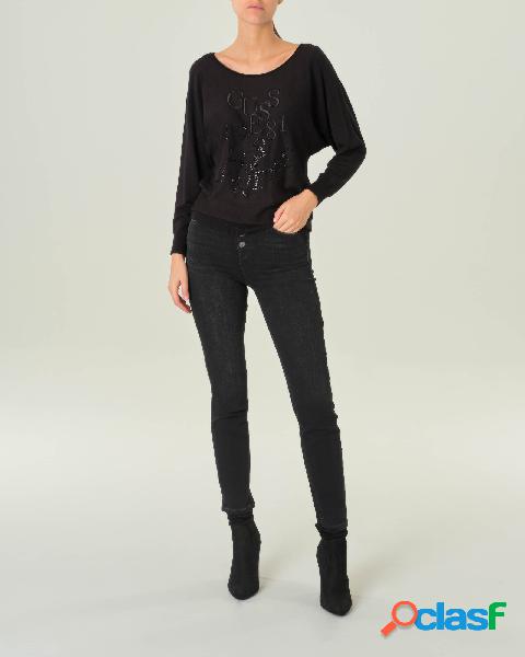 Jeans neri in denim di cotone e modal con bottoni di