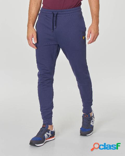 Pantalone blu in felpa con taschino sul retro